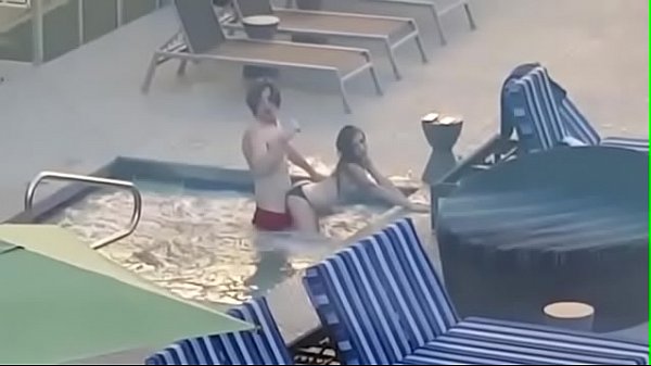 Voyeur couple caught fucking in a hotel pool
